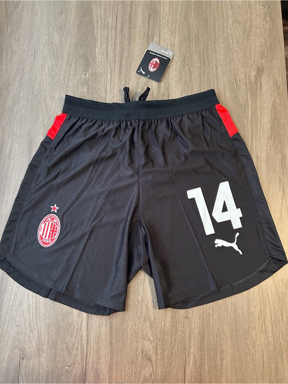 Puma Men's Black Athletic Shorts with Red Accents and White Number 14